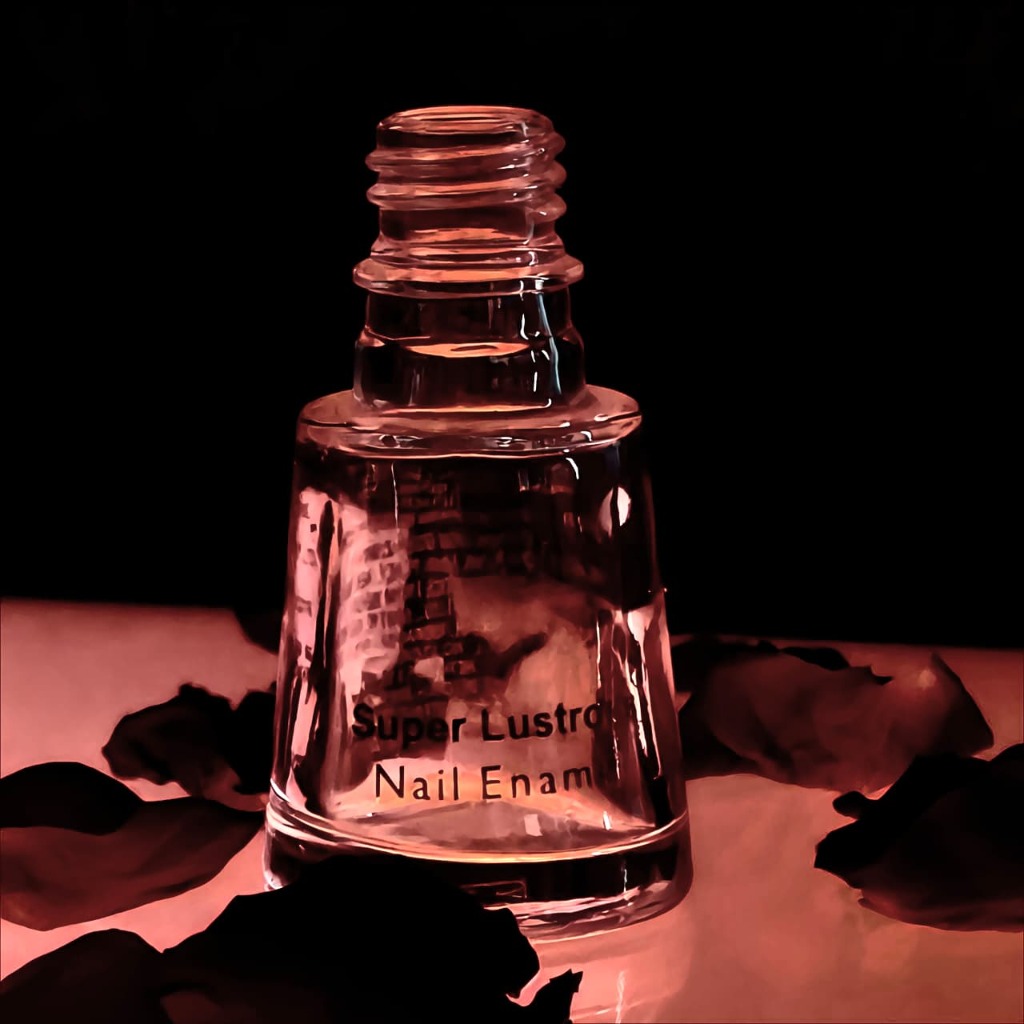 Revlon nail polish bottle with artistic photography showing screen printed label